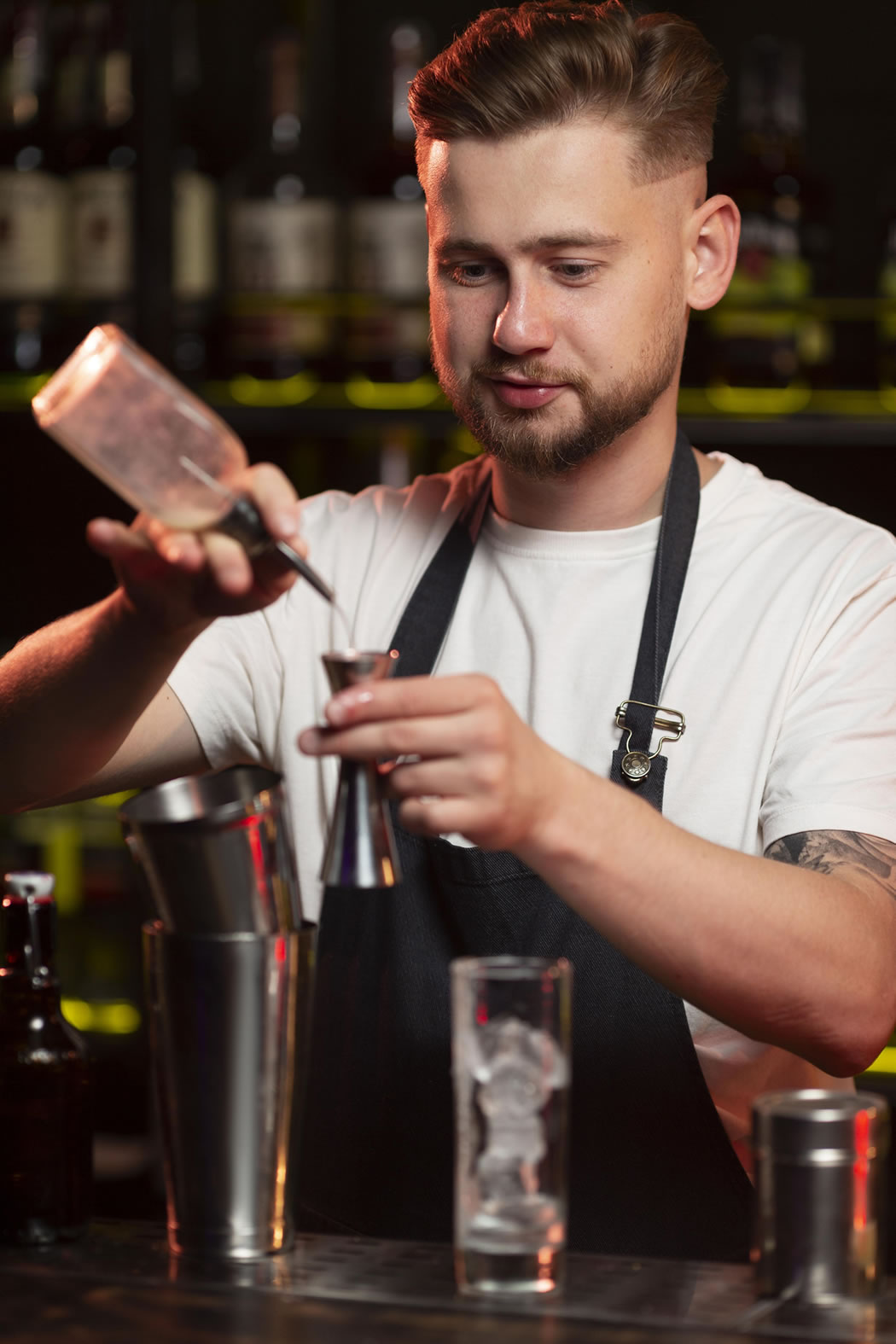Professional bartender preparing a cocktail at premium event